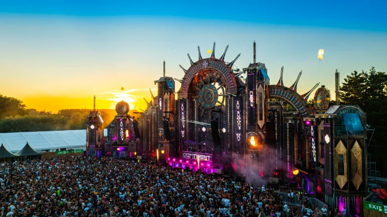 The Qontinent 2024 main stage at sunset with the crowd, aerial view