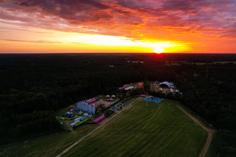 Aerial of Sunrise Festival 2022 at De Lilse Bergen at sunset