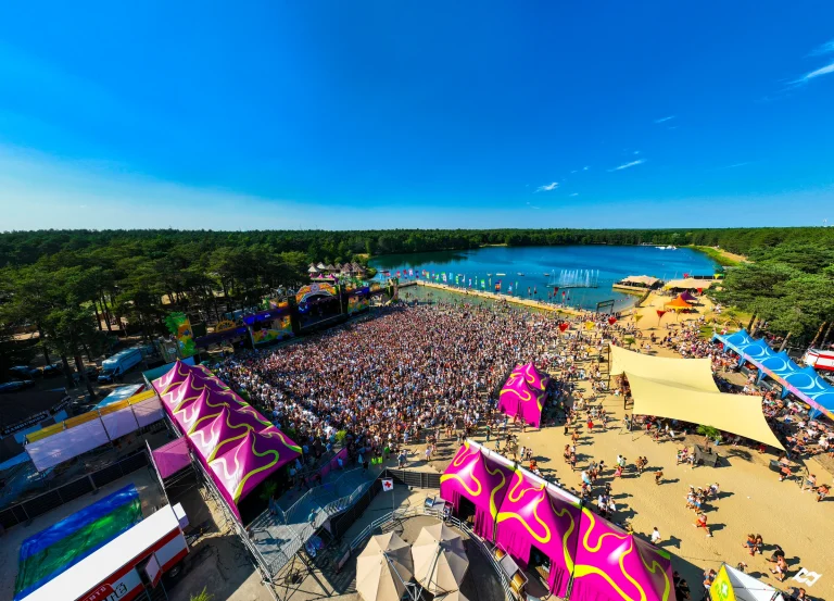 Aerial of Sunrise Festival 2023: beach, lake and crowd at De Lilse Bergen
