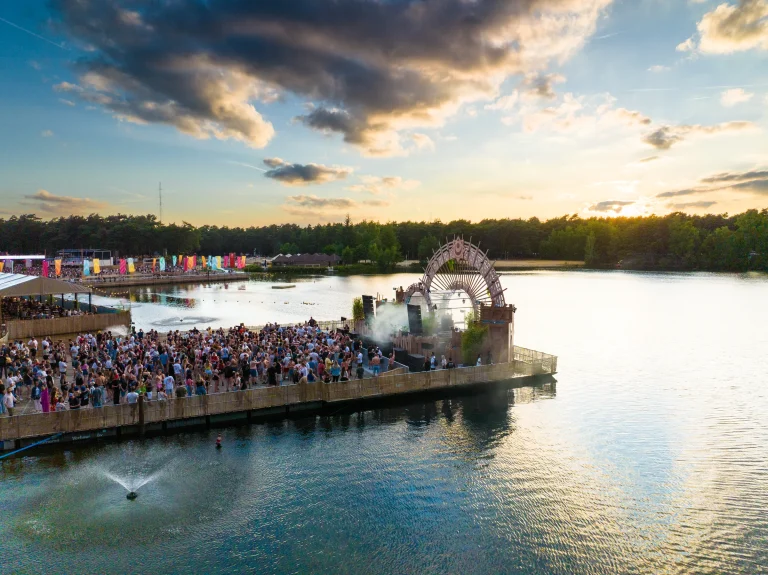 Sunrise Festival 2025 water stage on the De Lilse Bergen lake at sunset