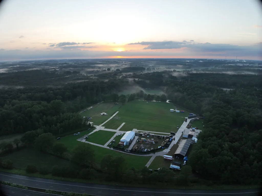 Sunrise aerial of the empty De Lilse Bergen site before the Sunrise Festival 2026 build