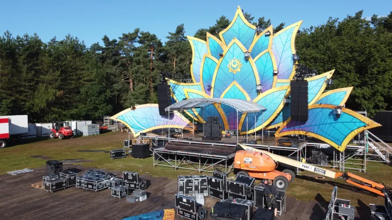 Lotus-shaped Sunset Festival 2021 main stage under construction with an aerial lift