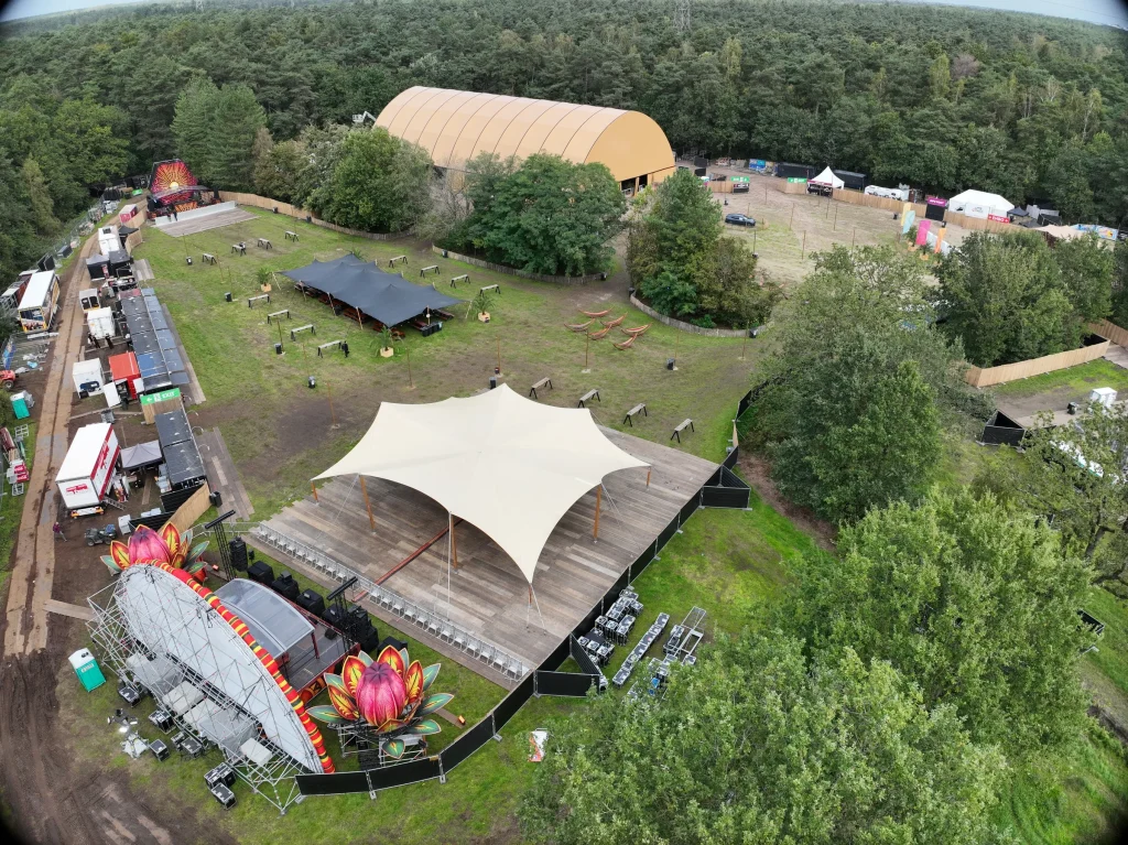 Aerial of Sunset Festival 2026 at De Lilse Bergen: stretch tent, stages and the large hall