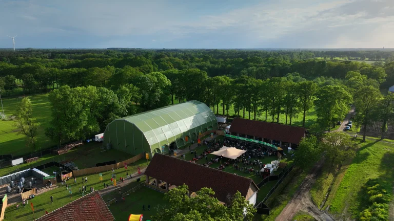 Aerial of Vagebond Weekend 2026: festival tent, courtyard and barns in Merksplas-Kolonie
